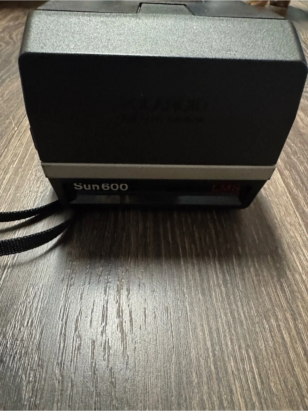 Polaroid Sun 600 with box of film
